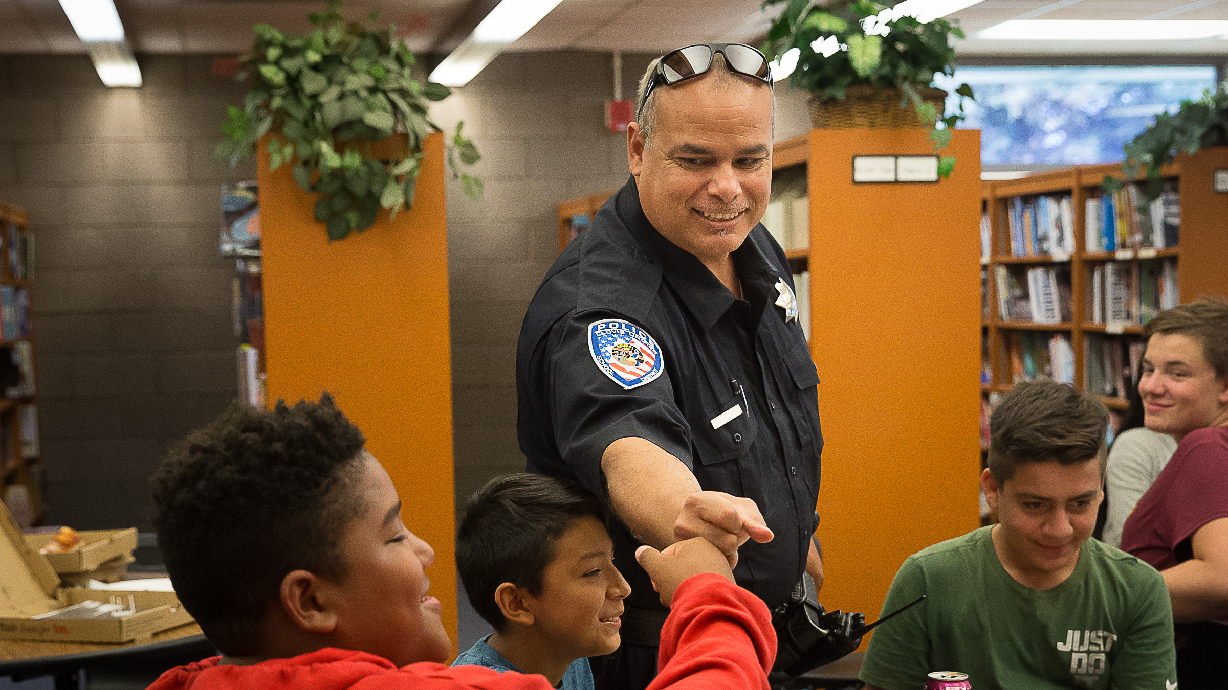 Officer Fist Bumps Student